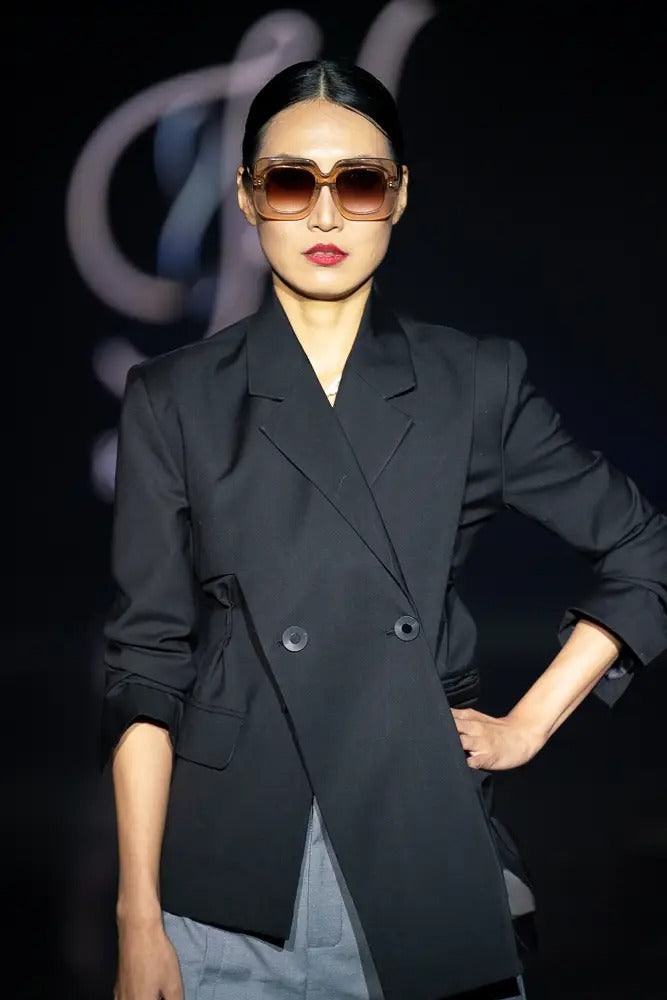 women’s loose fit blazer with elegant cross lapel design - cross lapel and button closure on women’s blazer - Cross lapel blazer paired with trousers for a sophisticated look