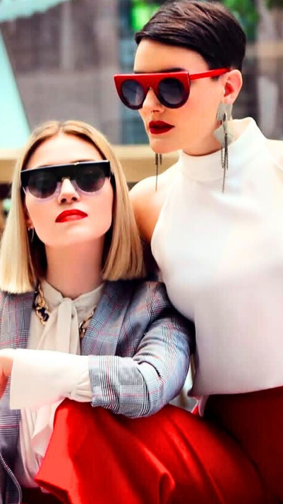 Man and woman modeling premium eyewear by Kazoku, showcasing the brand's signature craftsmanship and style.