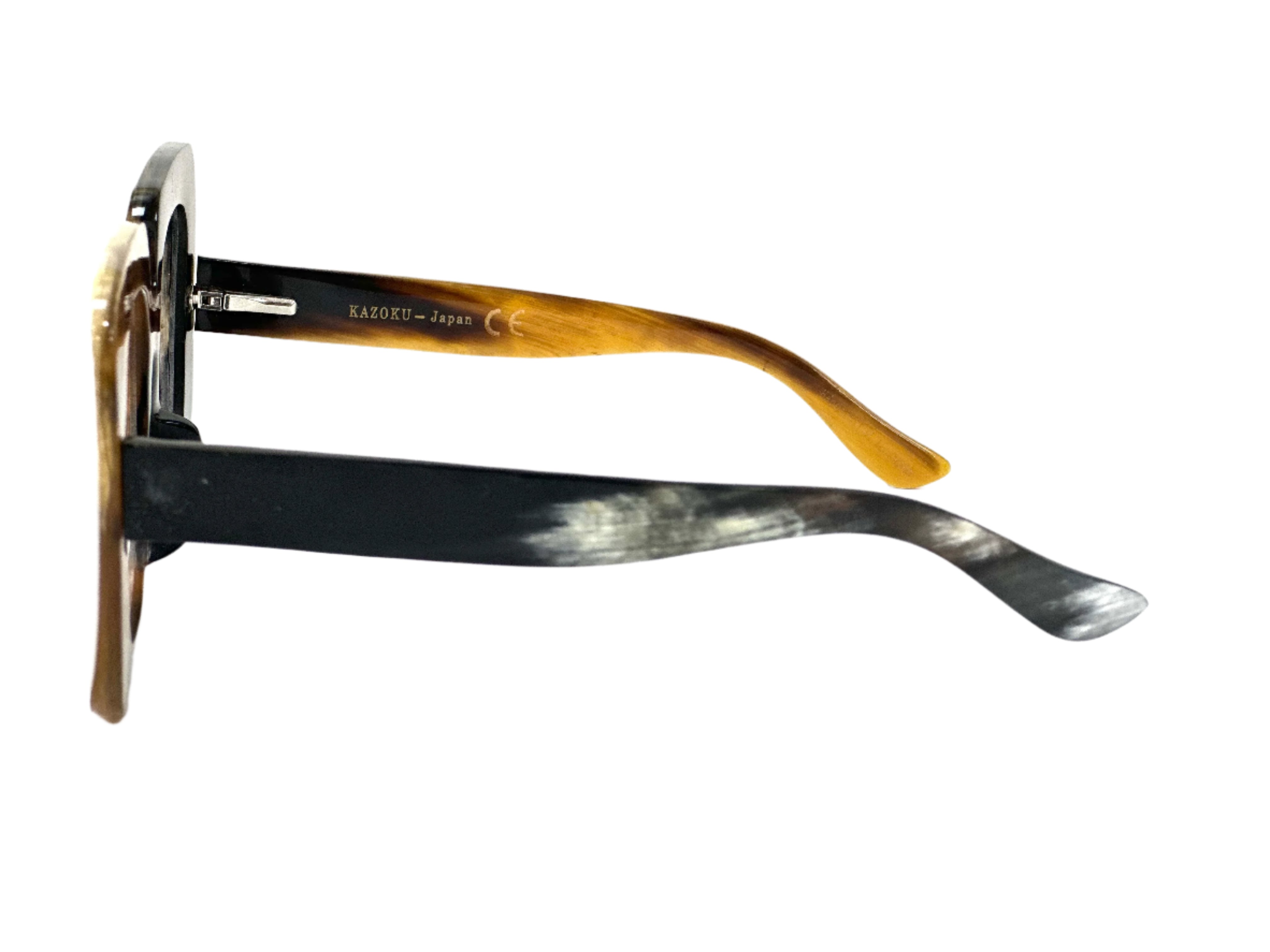 Pair of sunglasses with wooden arms - Natural horn material combined with modern lens technology - Special edition optical eyewear featuring horn craftsmanship - Handmade horn frames ready for prescription lens installation