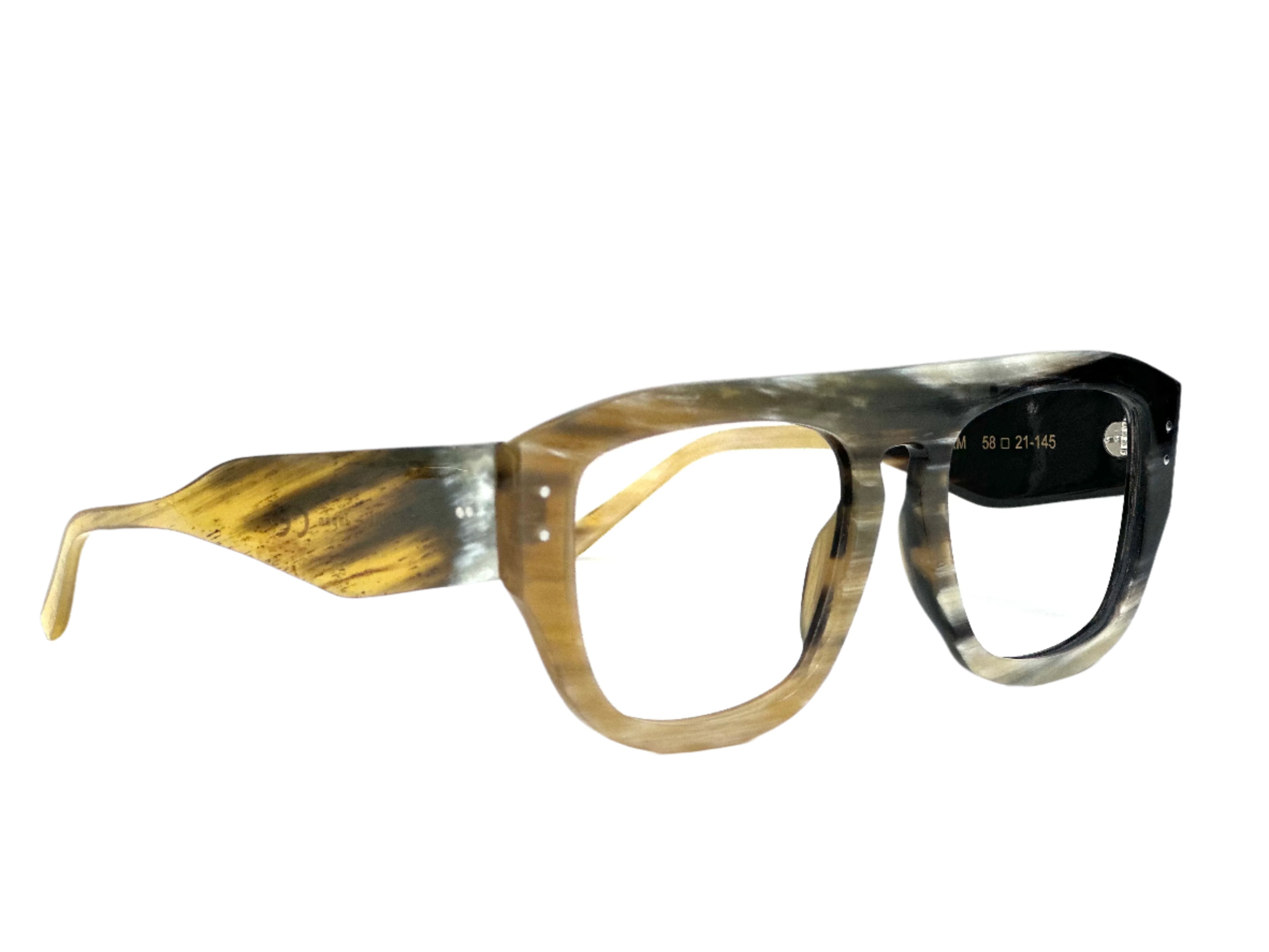 STORM glasses with anti-glare coating on polycarbonate lenses - Limited edition STORM glasses by Kazoku Lunettes – top view
Macro shot of horn texture and spring hinge on STORM frames
Lifestyle photo: person wearing STORM horn optical glasses indoors