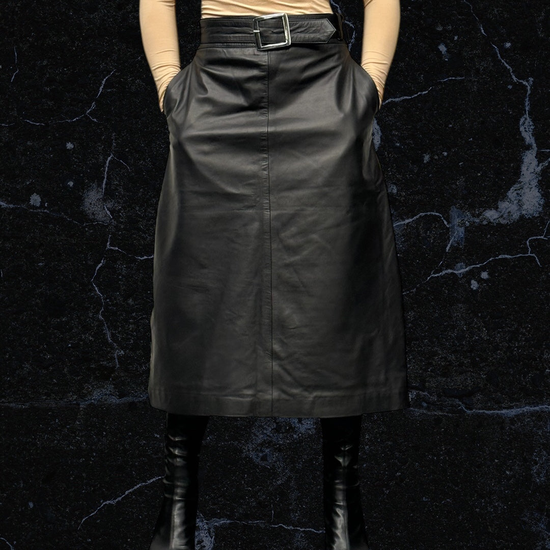 Women’s leather skirt styled with simple top and belt accent - Leather long skirt paired with heels for evening elegance - Kazoku Lunettes custom skirt – leather craftsmanship close-up
