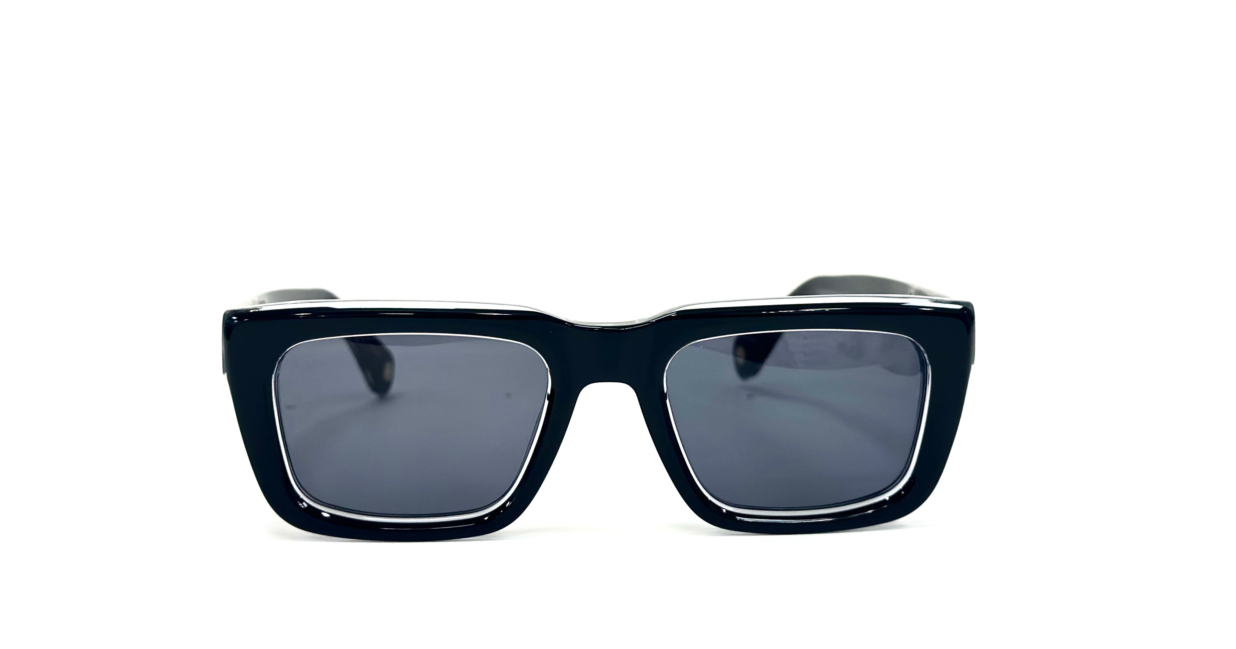 A pair of Kazoku lunettes DIEHARD sunglasses with thick, glossy black rectangular acetate frames and dark tinted lenses - Close-up of UFIT bridge for comfortable fit