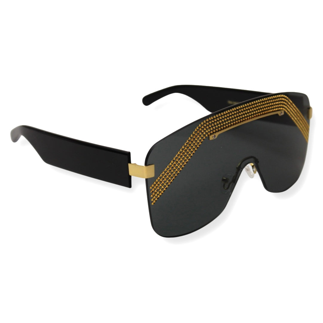 Kazoku Lunettes Relentless sunglasses – 3mm Trivex lenses and solid grey tint for men - Relentless shield sunglasses showing unique gold metal finish - Men wearing Kazoku Relentless oversized sunglasses with grey lenses outdoors