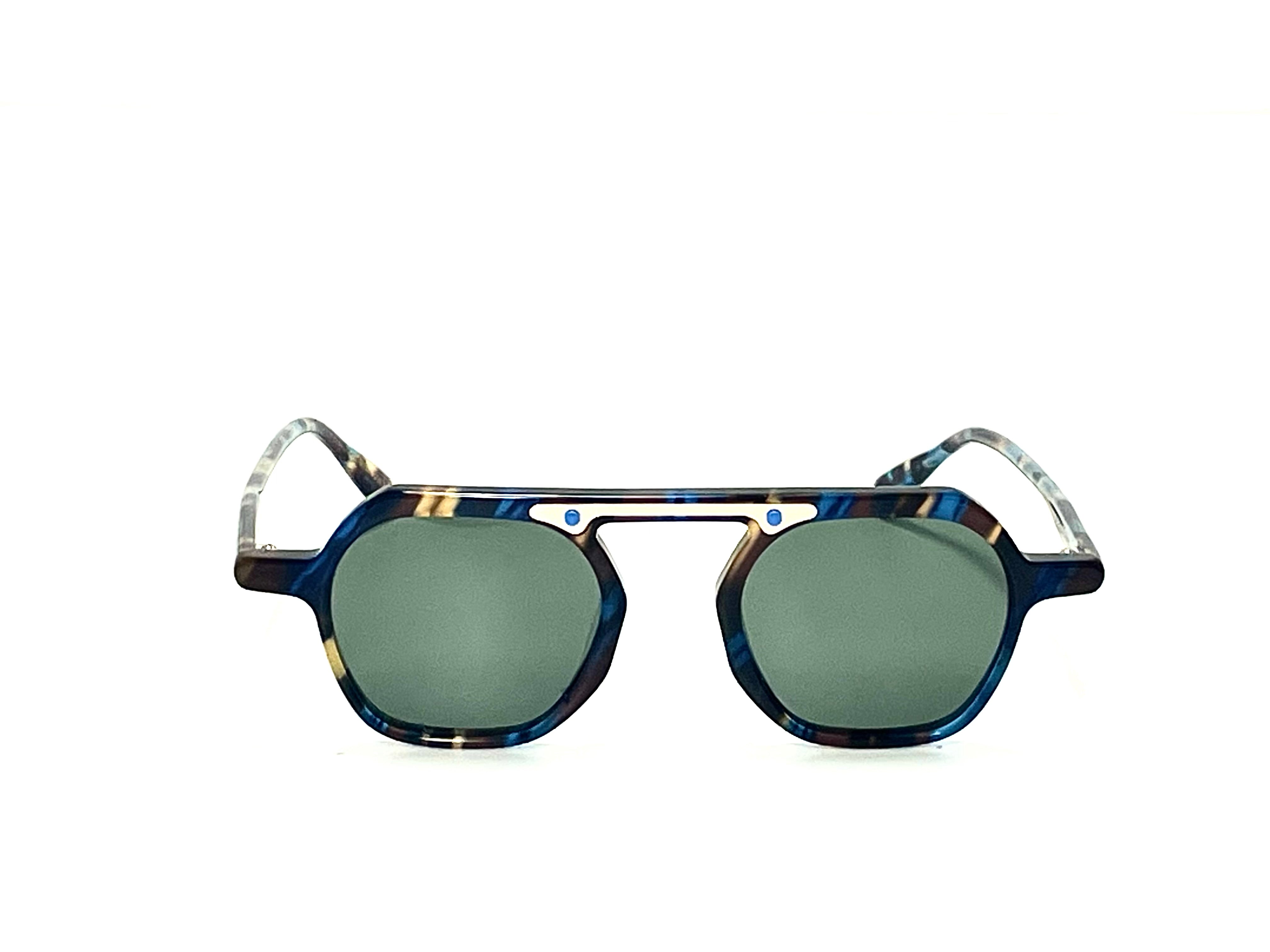 blue and green frame, offering UV protection and scratch resistance with polarized lenses - COMMANDER Sunglasses Folded Showcasing Hinge Design