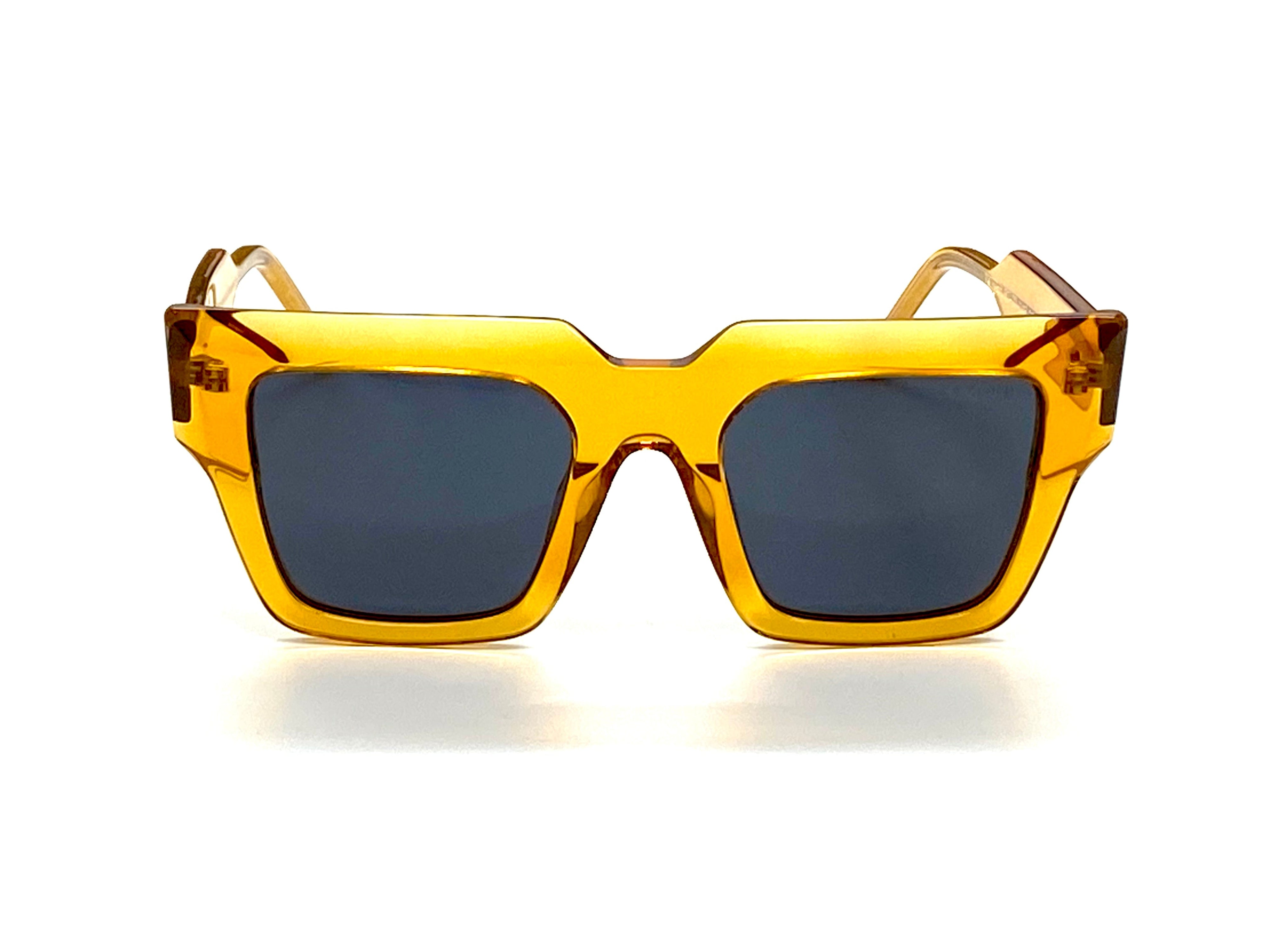 Yellow sunglasses with dark lenses - VALIANT acetate frames showing flexible temples - Close-up of U-Fit bridge resting comfortably on nose
