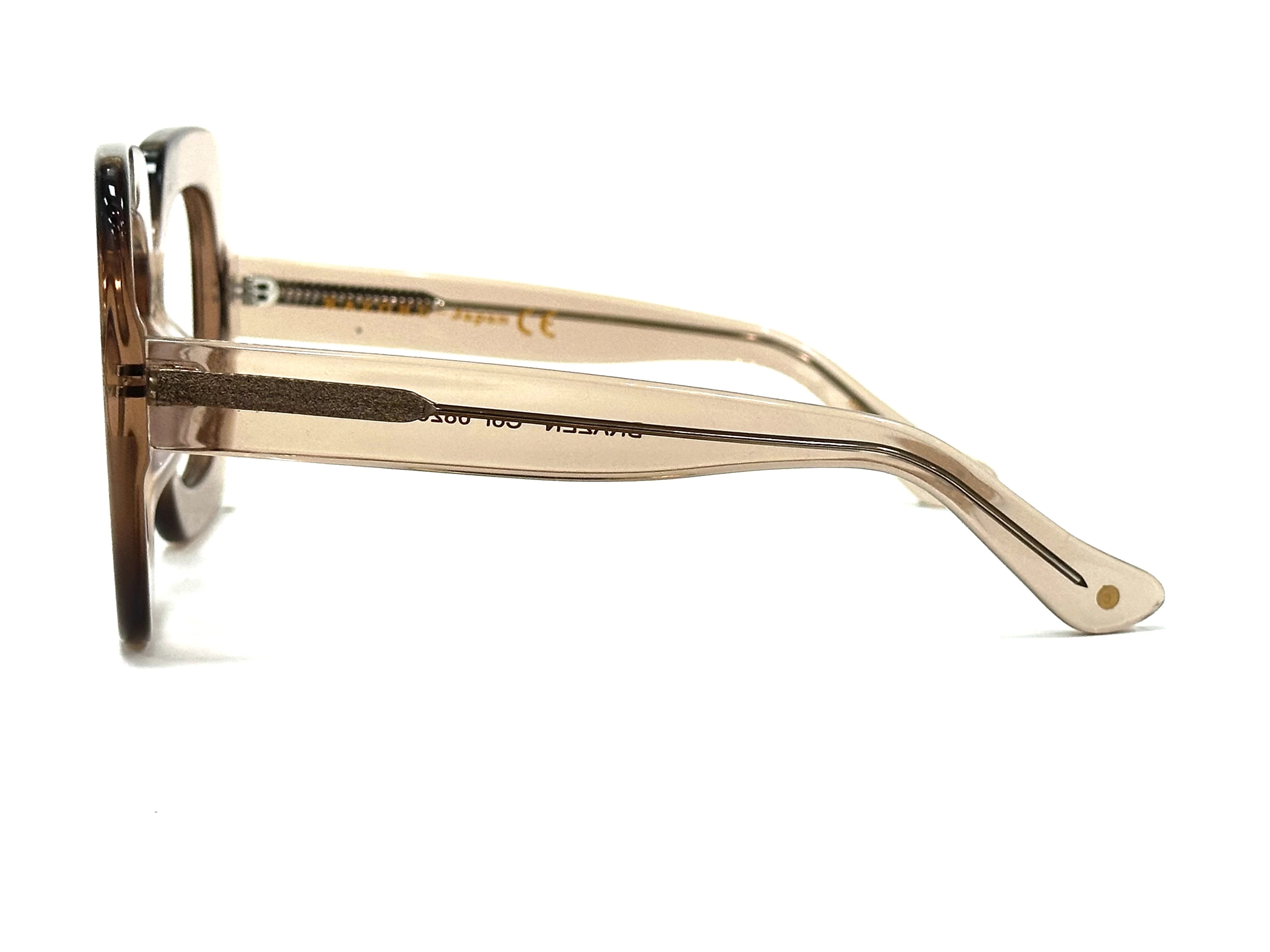 Bold acetate frames displayed alongside minimalist accessories - Why choose scratch-resistant lenses for everyday eyewear durability