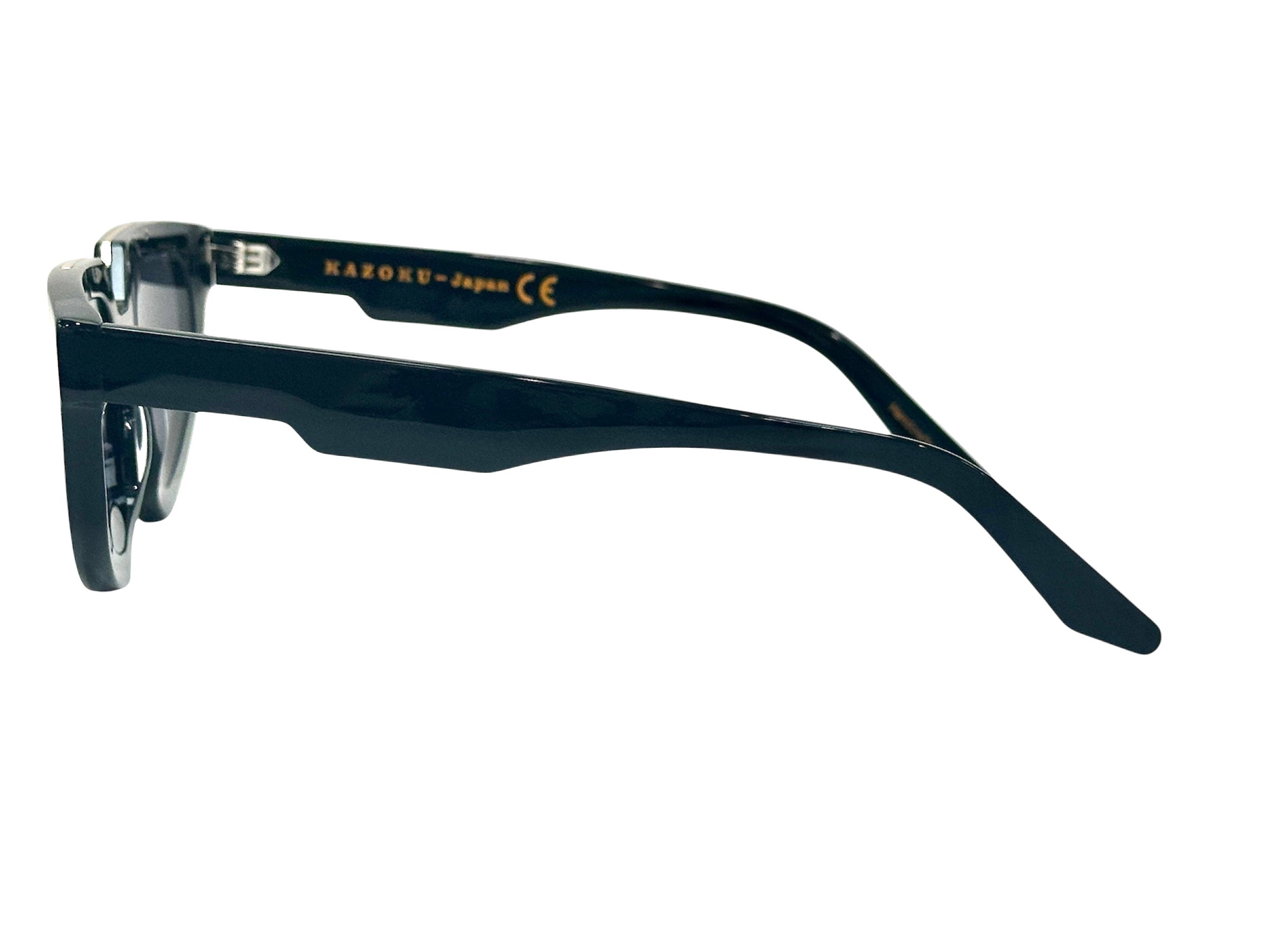 dark tinted lenses and gold accents - The glasses have a bold, modern design suitable for fashionable wear