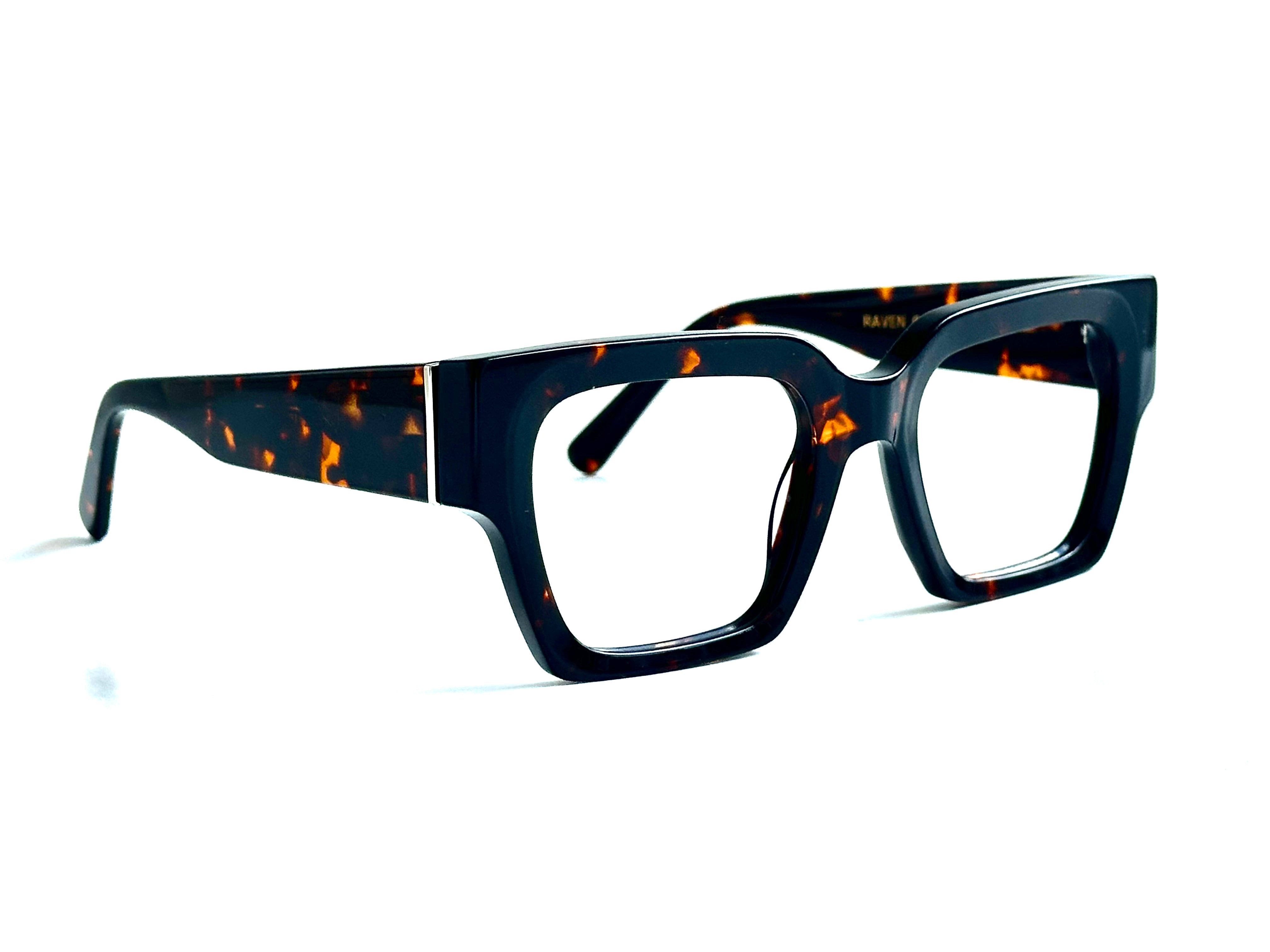 Pair of glasses with tortoiseshell frame - Close-up of acetate marble pattern texture